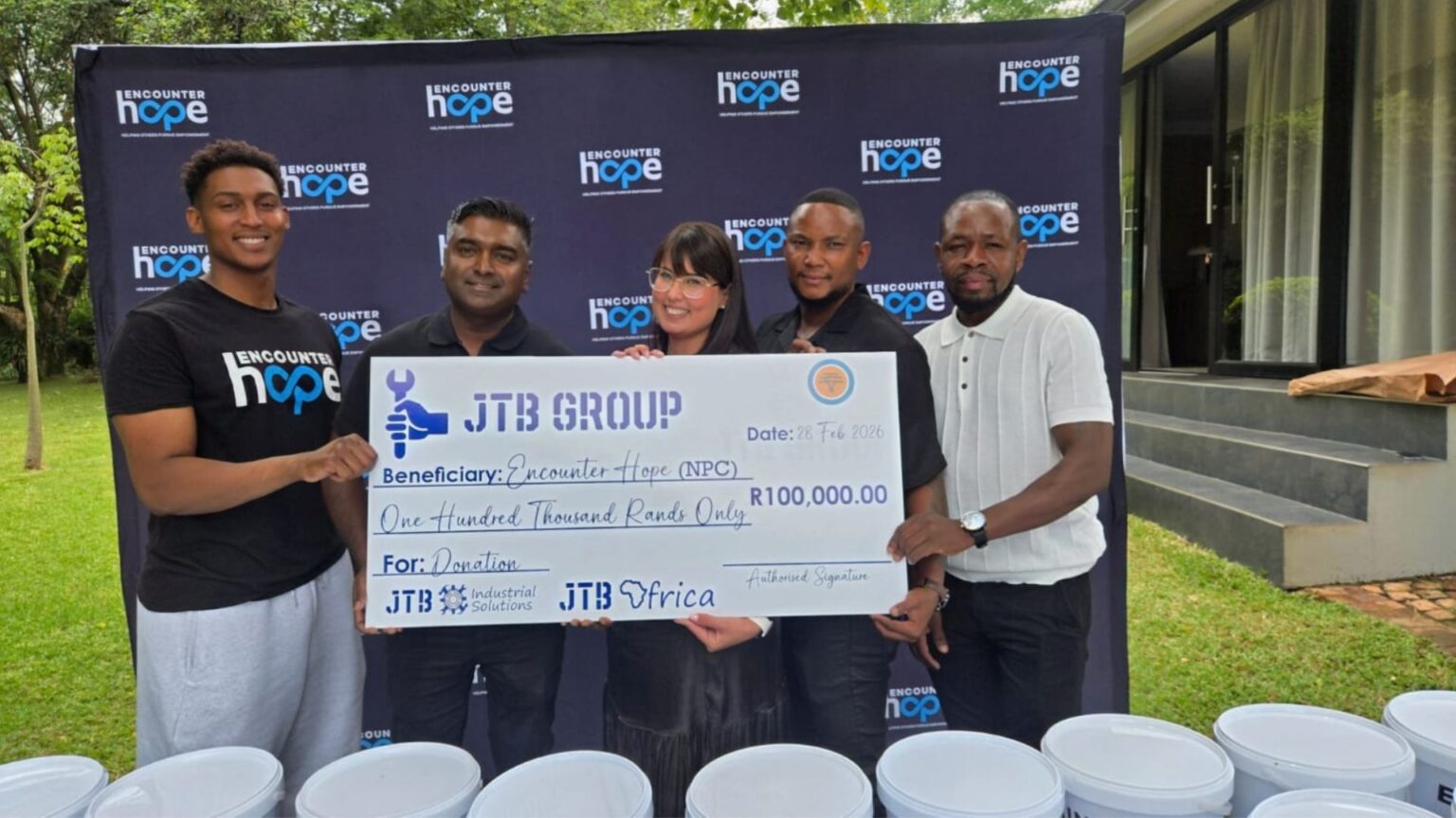 Joash with Pastor Nadine, Handing over R100 000 cash donation and food buckets